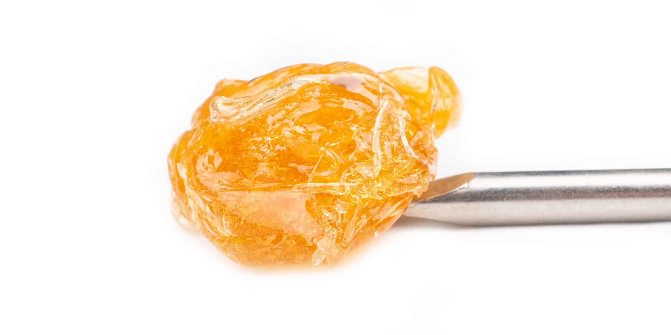 Amber cannabis concentrate on a metal dab tool